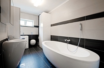 Modern bathroom with black tiles