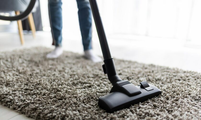 people-housework-housekeeping-concept-close-up-woman-with-legs-vacuum-cleaner-cleaning-carpet-home_231208-13612