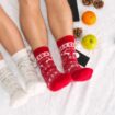 soft-photo-woman-man-bed-with-phone-fruits-top-view-point-female-male-legs-couple-warm-woolen-socks_155003-21534